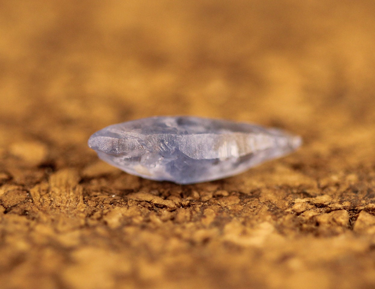 This is alight blue sapphire (corundum) crystal. 

Obtained from Rakwana, Sri Lanka.

Weight is 1.89 carats. 

Height is 13.5 mm. It contains a glass body and a beautiful luster.